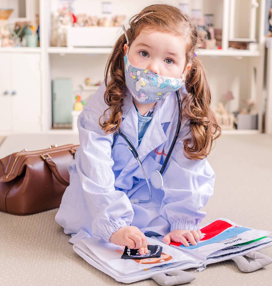 Child exploring jobs with When I Grow Up role play quiet book